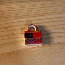 Load image into Gallery viewer, Co@ch Orange Purse Silicone Focal Bead