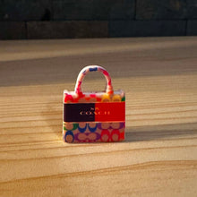 Load image into Gallery viewer, Co@ch Orange Purse Silicone Focal Bead