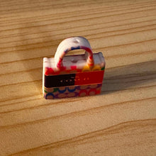 Load image into Gallery viewer, Co@ch Orange Purse Silicone Focal Bead
