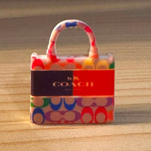 Load image into Gallery viewer, Co@ch Orange Purse Silicone Focal Bead
