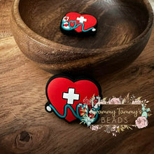 Load image into Gallery viewer, First Aid Heart Silicone Focal Bead Beads
