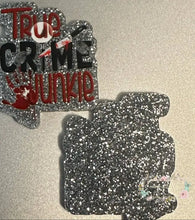 Load image into Gallery viewer, HAS A DEFECT - True Crime Glitter Flatback - has two spots on it Glitter Flatback
